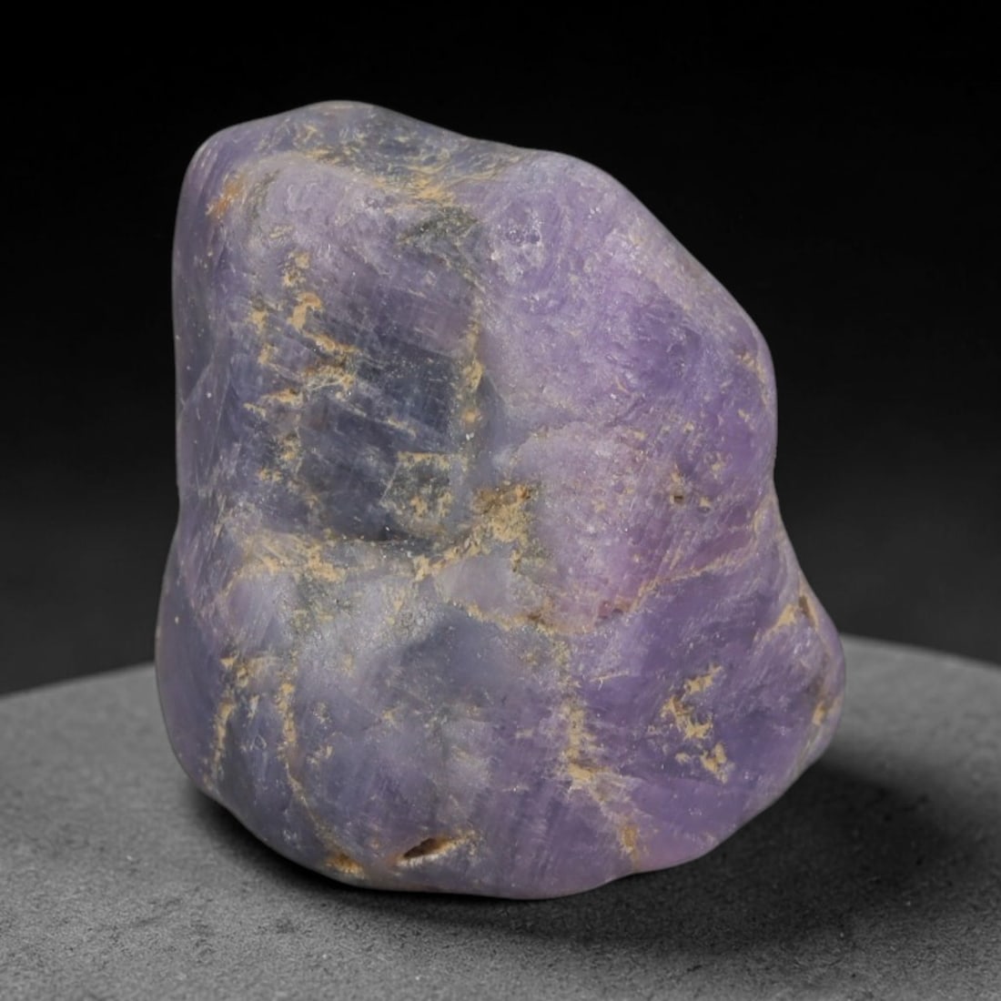 48ct Natural Unheated Sri Lankan Purplish Blue Sapphire Rough, 61YQ: This natural corundum rough is an unheated purplish blue sapphire sourced from Sri Lankan alluvial gem deposits, featuring an irregular natural native form with residual pale yellow-brown mineral matr