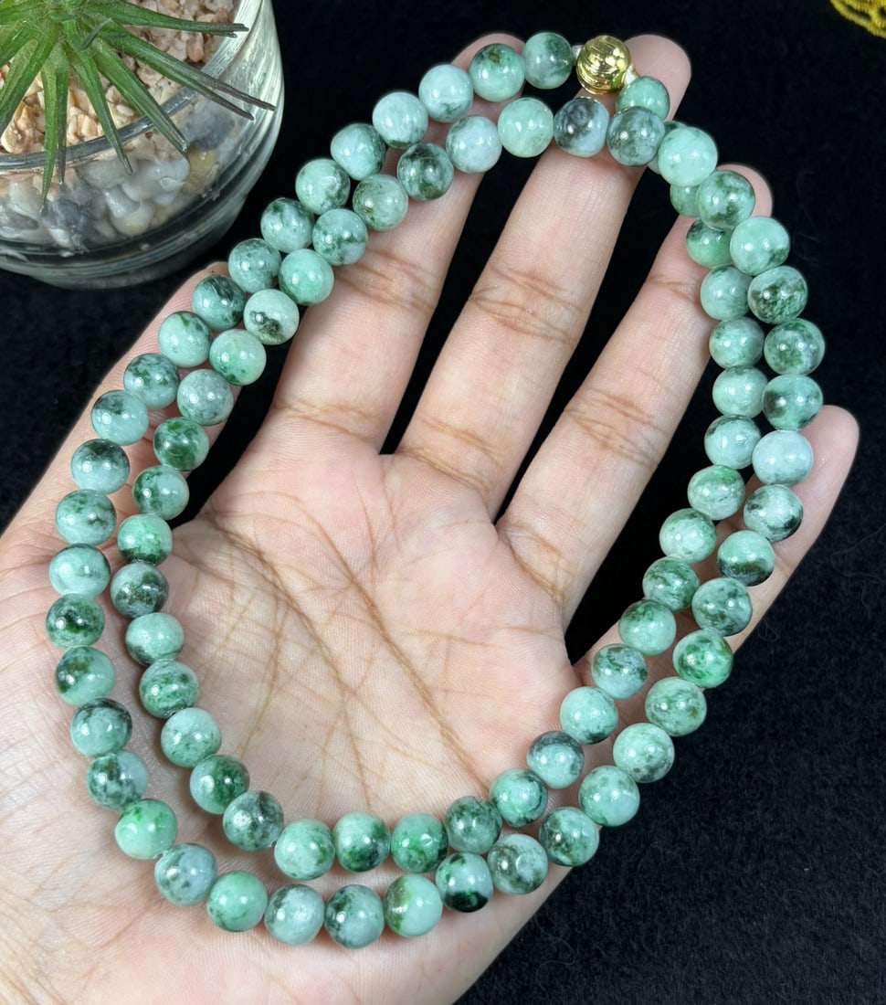 Natural Burmese Type A Grass Green Speckled Jadeite Beaded Necklace, 27YM: Hand-strung natural Burmese Type A jadeite round beads covered with fine scattered grass-green speckles across a pale translucent base, forming classic moss-in-snow texture. Every bead is evenly shape