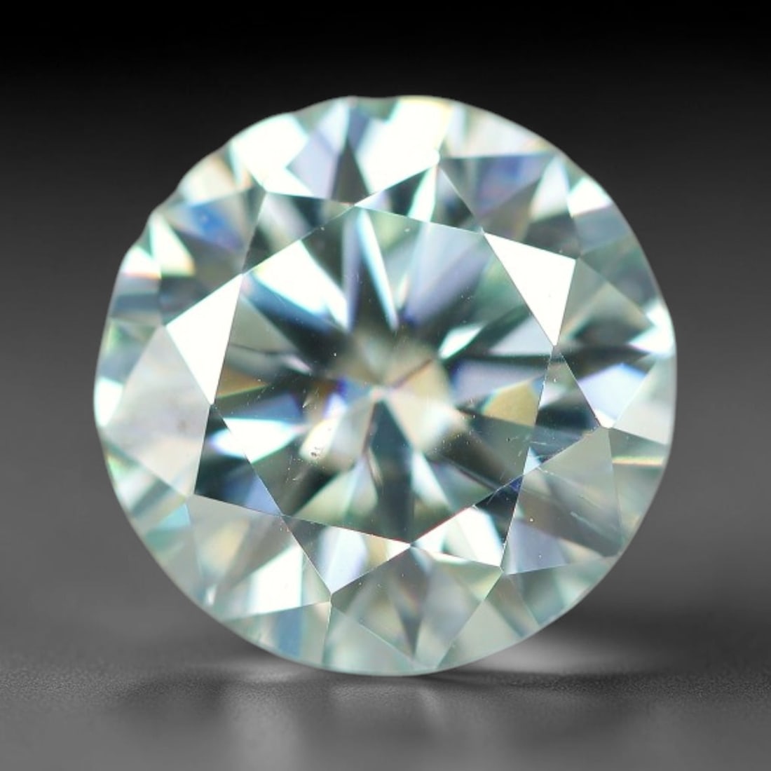 0.96 Carats Aqua Toned Moissanite Loose Gemstone, 68WP: This moissanite features dimensional measurements of 6.3x4mm, lab-grown silicon carbide material valued for superior light refraction that delivers vivid multi-hued sparkle across all lighting conditi
