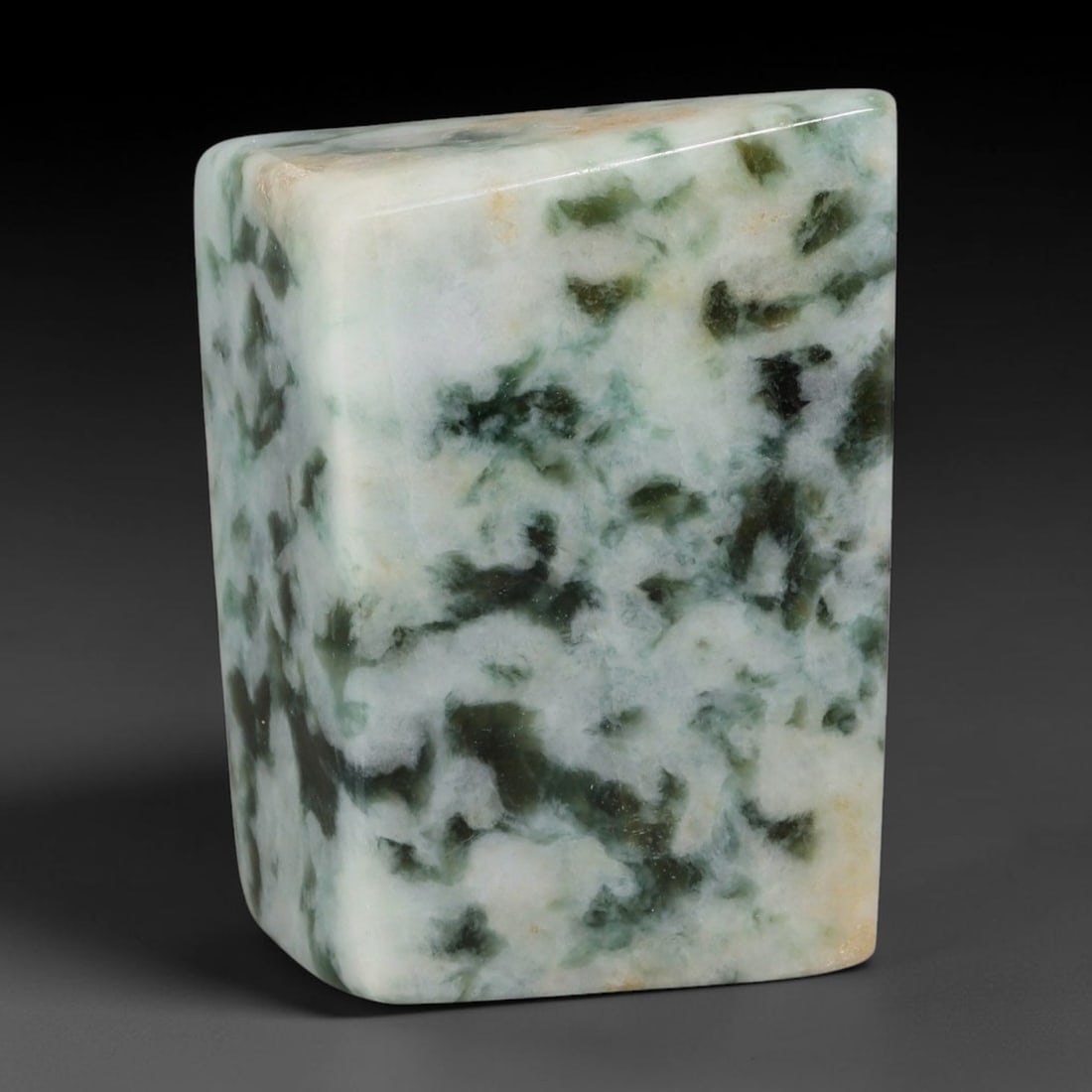 330ct Natural Type A Burmese Jadeite Jade Sliced Rough, 25YR: This specimen is a sliced rough block of natural Type A Burmese jadeite jade. The interior displays natural colour zoning with visible mineral veining and crystalline patterns typical of unprocessed j