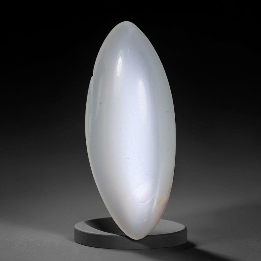 6.65 Carats Natural Ceylon Soft Milky White Moonstone Oval Cabochon Loose Gemstone, 83WS: This soft milky white Ceylon moonstone oval cabochon displays a uniform translucent pale cream feldspar base with faint diffused adularescent glow across its smoothly domed polished surface. A single 