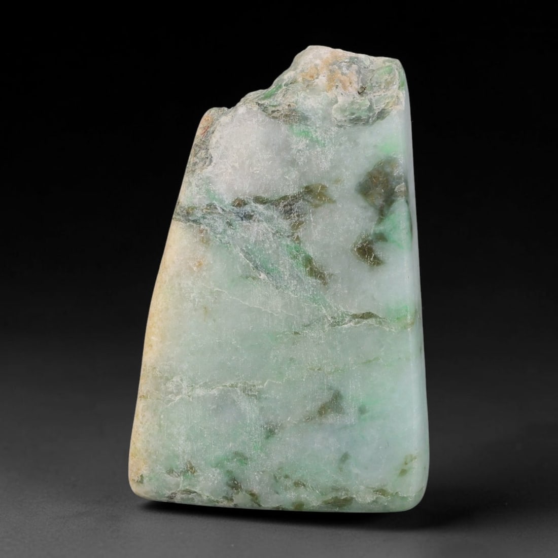 260ct Natural Type A Burmese Jadeite Jade Sliced Rough, 15YR: This specimen is a sliced rough block of natural Type A Burmese jadeite jade. The interior displays natural colour zoning with visible mineral veining and crystalline patterns typical of unprocessed j
