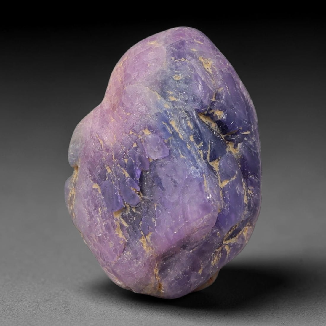 40ct Natural Unheated Sri Lankan Purplish Blue Sapphire Rough, 38YQ: This natural corundum rough is an unheated purplish blue sapphire sourced from Sri Lankan alluvial gem deposits, featuring an irregular natural native form with residual pale yellow-brown mineral matr