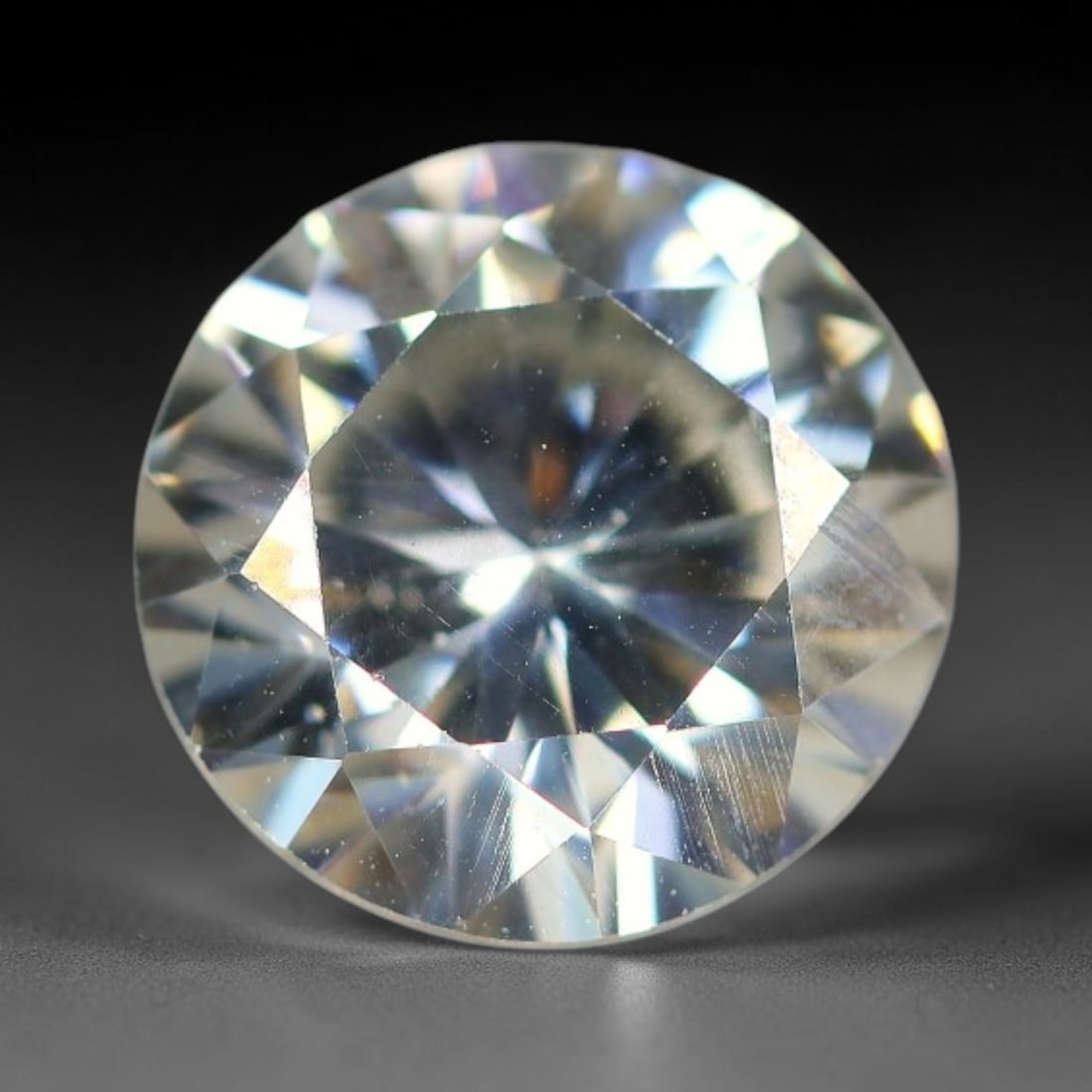 2.36 Carats Clear Moissanite Loose Gemstone, 77WP: This moissanite features dimensional measurements of 8.9x5mm, a lab-created silicon carbide gem material celebrated for an impressive refractive index that creates intense light dispersion and dynamic