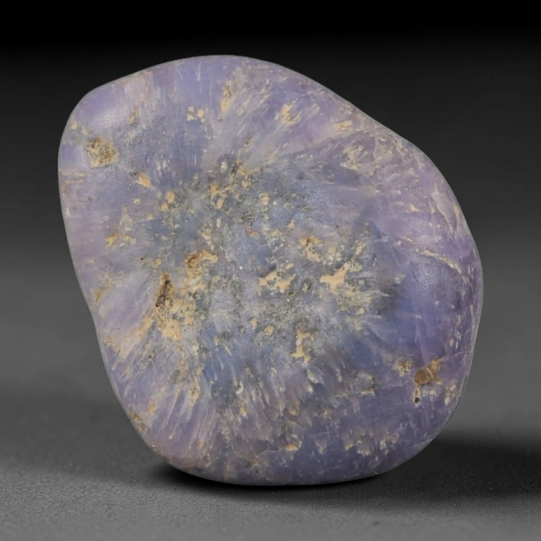 25ct Natural Unheated Sri Lankan Purplish Blue Sapphire Rough, 57YQ: This natural corundum rough is an unheated purplish blue sapphire sourced from Sri Lankan alluvial gem deposits, featuring an irregular natural native form with residual pale yellow-brown mineral matr