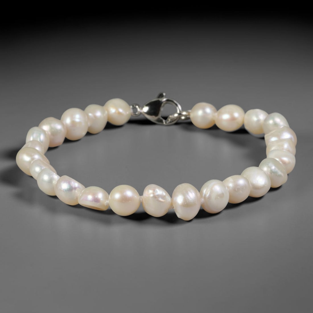 Natural Freshwater Pearl Bracelet - Baroque Soft White Pearl Strand, 68YM: Strung from compact organic baroque natural freshwater pearls with gentle luminous white pearlescent sheen, each bead bearing unique small asymmetrical rounded contours typical of naturally cultivated