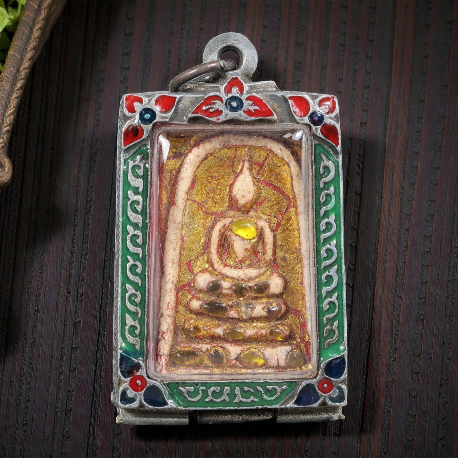 Thai Phra Somdej Amulet - Enamel Silver Tone Pendant, 58ZB: A Thai Buddhist Phra Somdej amulet featuring a seated Buddha figure on tiered bases, housed in a silver-tone metal casing with colorful enamel detailing. The glass-fronted enclosure protects the amule