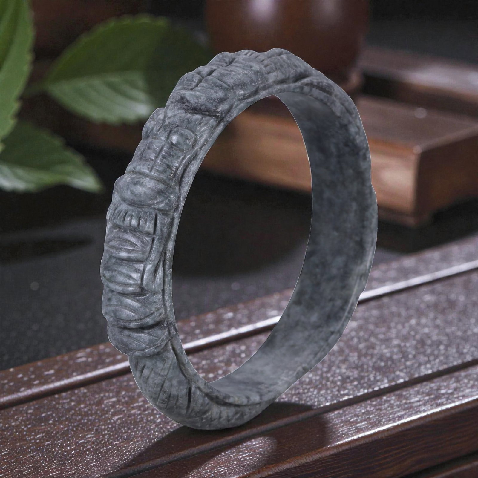 Jadeite Jade Dragon Bracelet - Carved Asian Bangle, 6.3cm Inner Diameter, 28WE: Carved from dense grey-green jadeite, this bracelet is formed as a continuous circular bangle with sculptural relief carving along the exterior surface. The stone has been hollowed and shaped through 