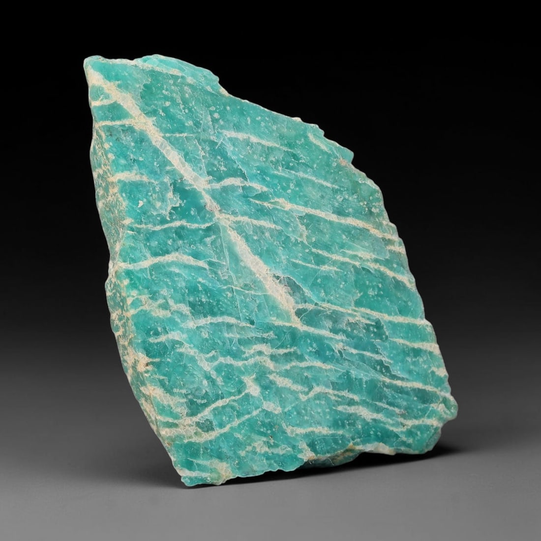 88ct Natural Russian Ural Amazonite Slab Rough, 71WV: This intact amazonite slab features distinct parallel mineral banding running uniformly across its naturally split flat surface within 51x29x10mm slab dimensions, retaining unmodified natural geologic