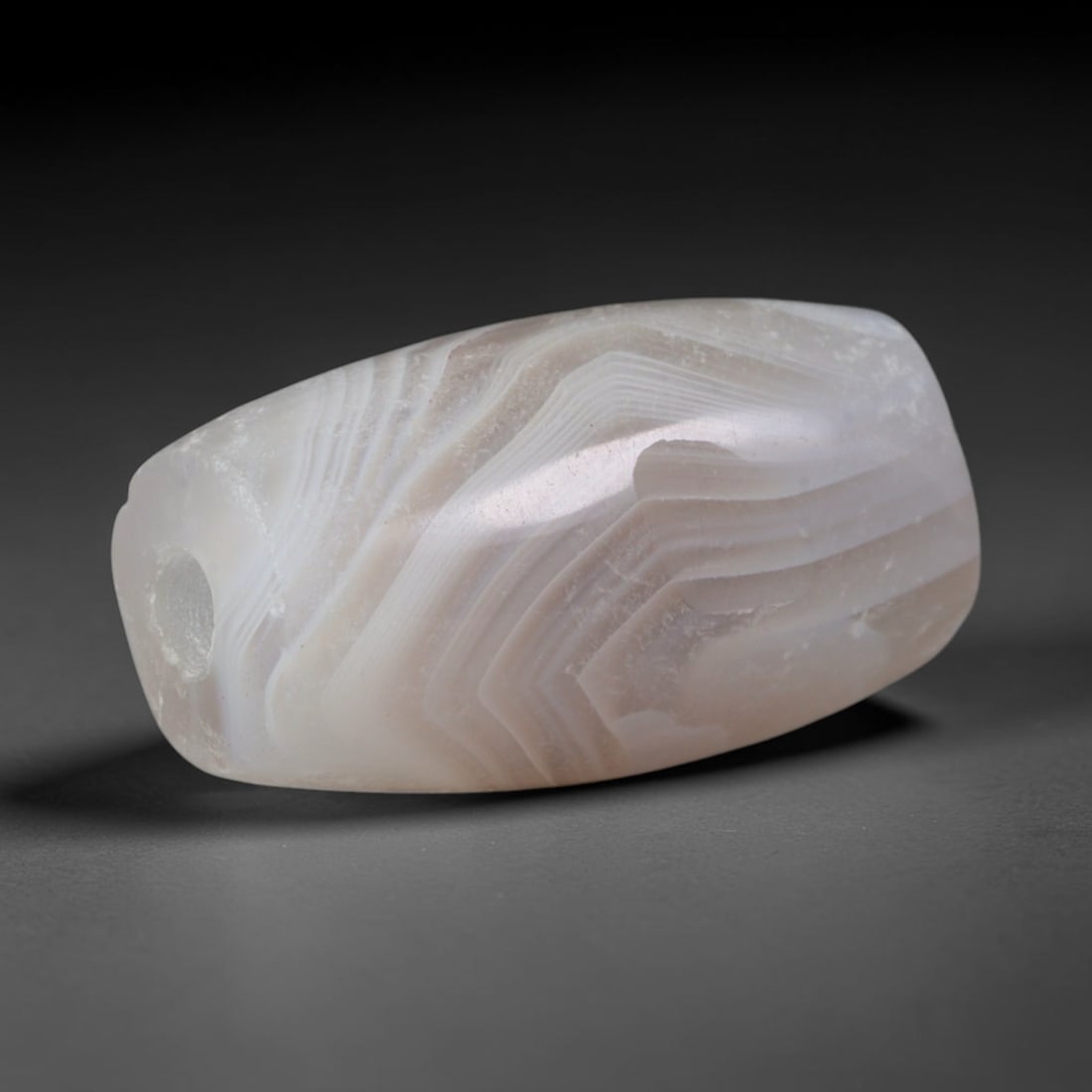 Ancient Indus Valley / Harappan Civilization Banded Agate Cylinder Bead (2600-1900 BCE), 68XD: This antique banded agate cylinder bead originates from the Indus Valley / Harappan Civilization, the ancient South Asian culture celebrated as the world's pioneering center of standardized agate bead