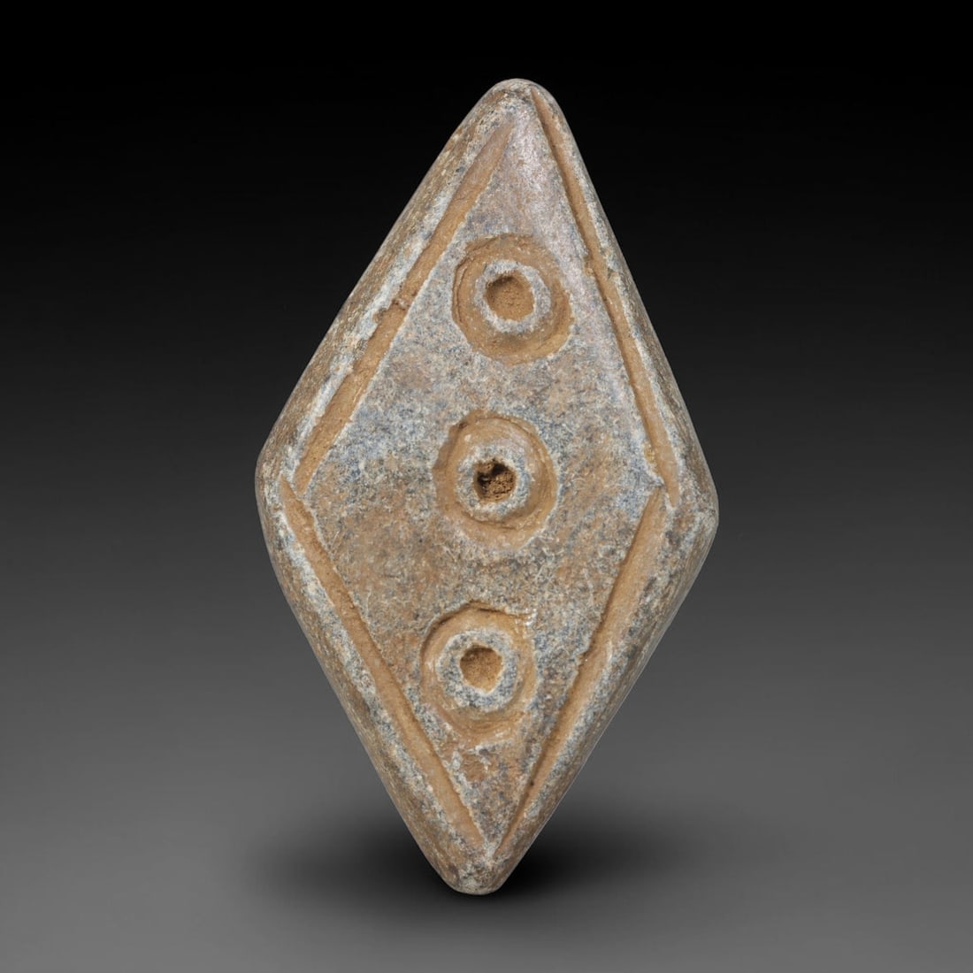 Ancient Near Eastern Hand Carved Schist Protective Amulet, 50WT: Compact antique wearable sacred talisman hand hewn from natural speckled schist metamorphic stone, originating from the broad cultural sphere of the Ancient Near East. Schist was a staple carving mine