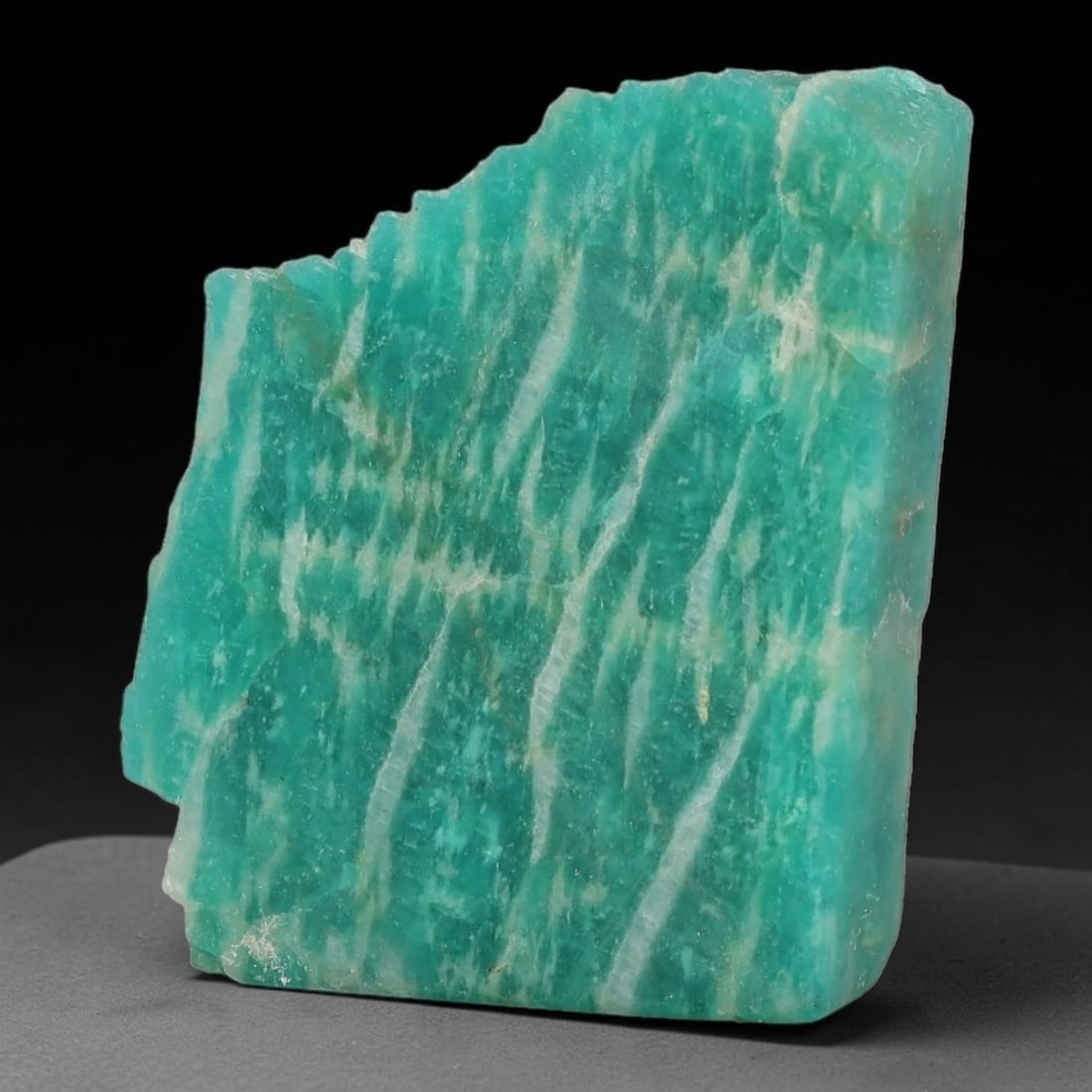 53ct Natural Russian Ural Amazonite Slab Rough, 33WV: This intact amazonite slab features distinct parallel mineral banding running uniformly across its naturally split flat surface within 29x23x8mm slab dimensions, retaining unmodified natural geologica