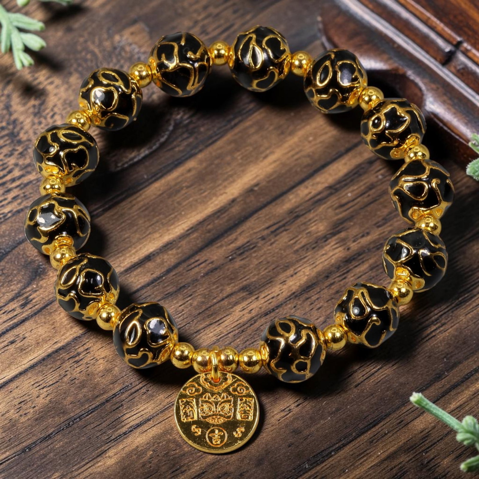 Chinese Cloisonne Enamel Beaded Bracelet - Black Gold Lion Head Coin Charm, 63YG: This modern Chinese revival stretch bracelet features large round cloisonne enamel beads measuring 10.00 millimeters, finished in glossy black enamel covered with bold raised gold-tone abstract cloud 