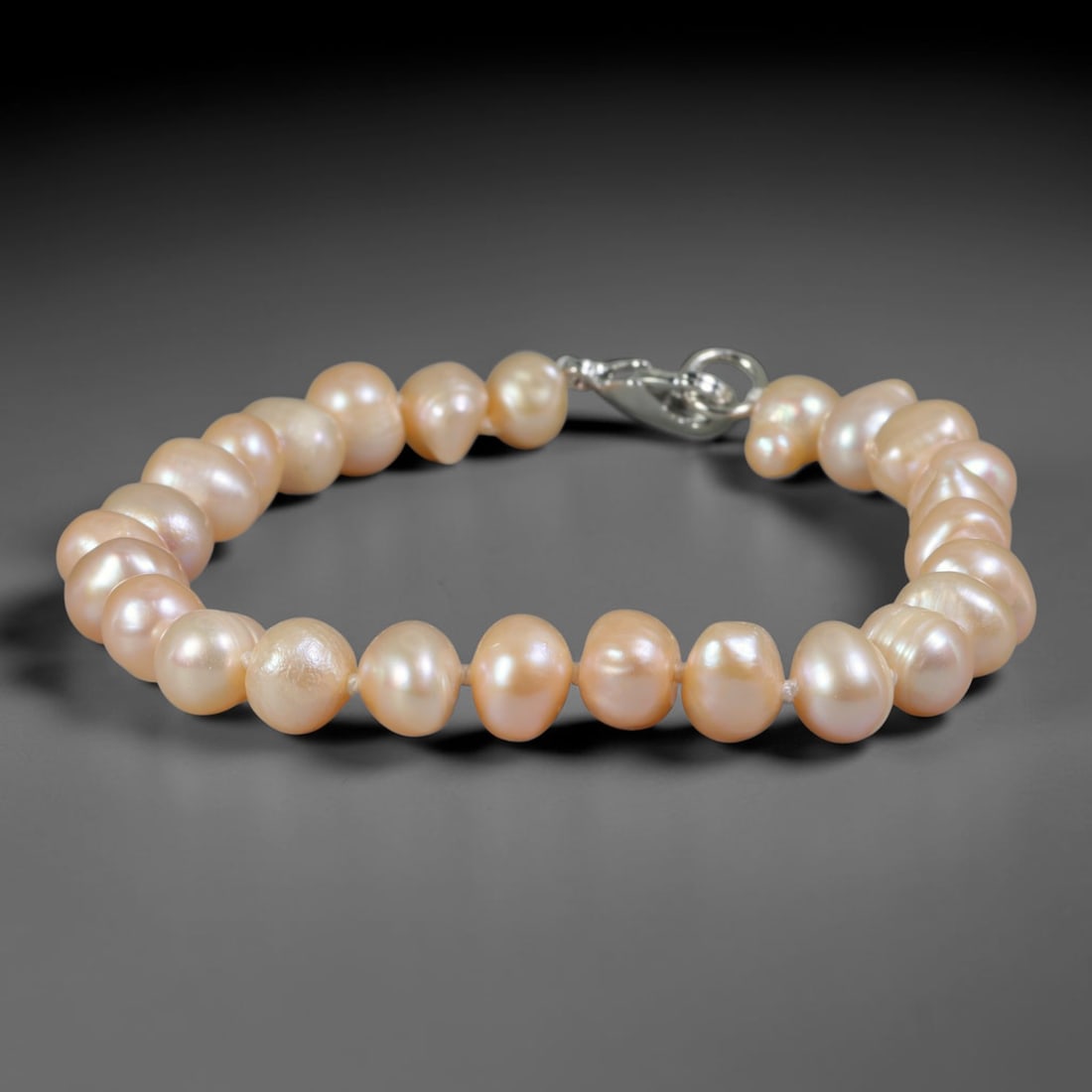 Natural Freshwater Pearl Bracelet - Baroque Soft Champagne Pearl Strand, 72YM: Hand-strung with medium-small organic baroque natural freshwater pearls showcasing warm soft champagne pearlescent glow, each bead carries unique asymmetrical rounded freeform contours from natural pe