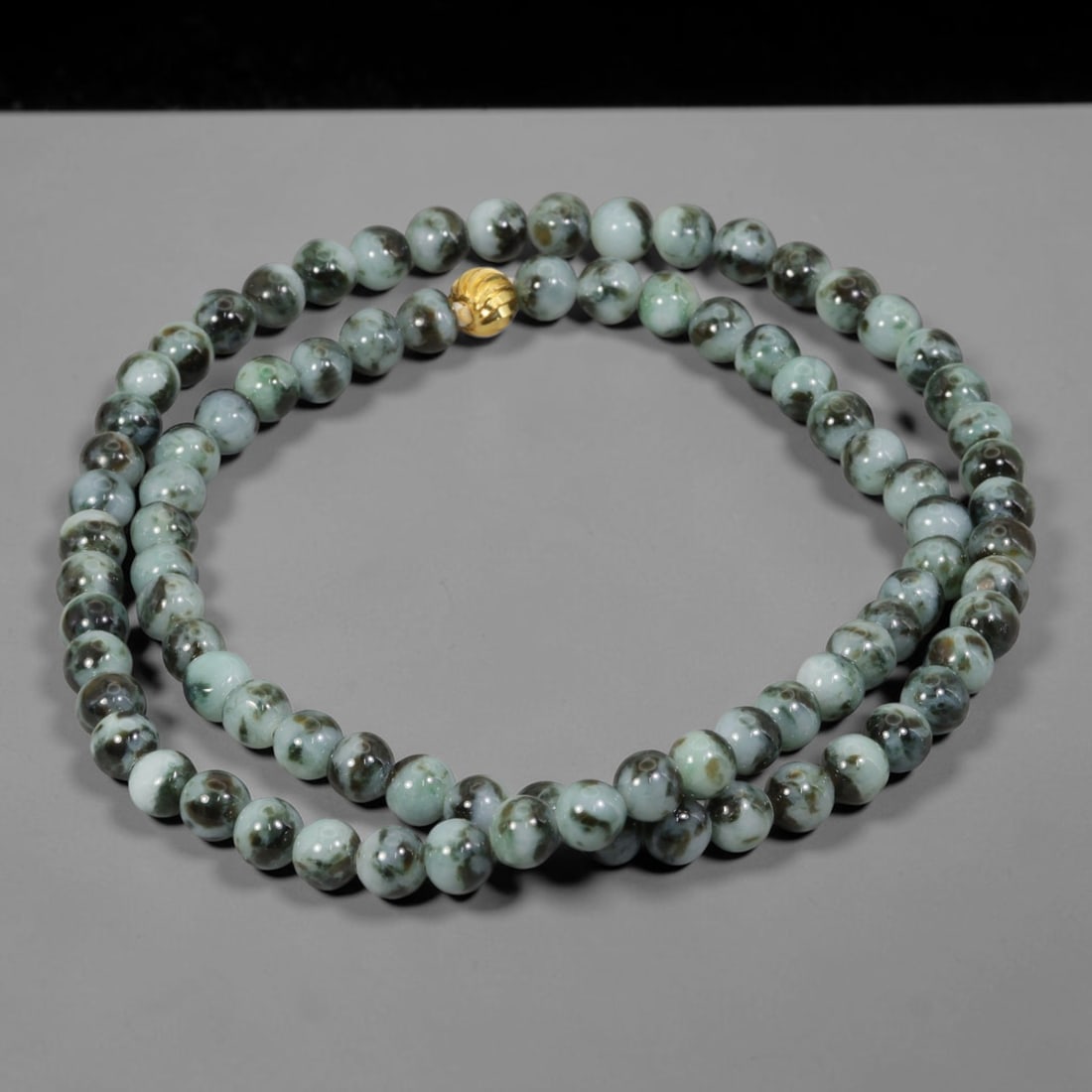 Natural Burmese Type A Floating Flower Jadeite Jade Beaded Necklace, 19WY: Formed from untreated Burmese Type A jadeite material, each spherical bead carries naturally formed floating mineral inclusions scattered evenly throughout the stone structure, finished with refined u