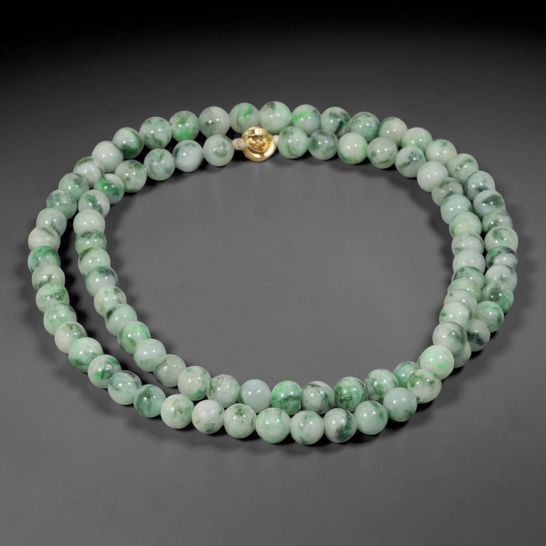 Natural Burmese Type A Pale Floating Jadeite Jade Beaded Necklace, 12WY: Constructed from unprocessed Burmese Type A jadeite stone, each spherical bead displays soft scattered green mineral flecks naturally integrated into the pale stone matrix through geological formation