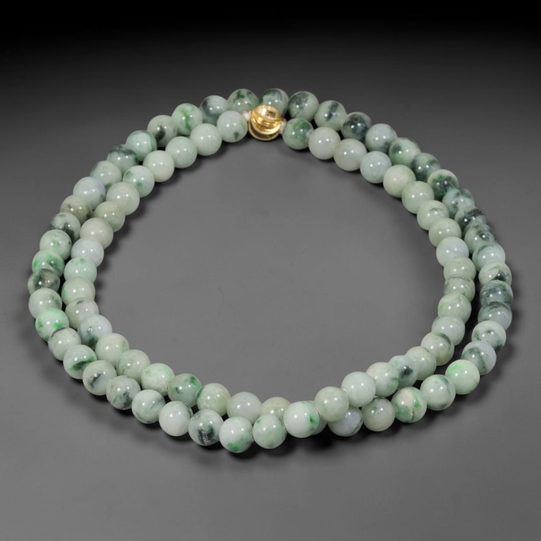 Natural Burmese Type A Pale Floating Jadeite Jade Beaded Necklace, 15WY: Constructed from unprocessed Burmese Type A jadeite stone, each spherical bead displays soft scattered green mineral flecks naturally integrated into the pale stone matrix through geological formation