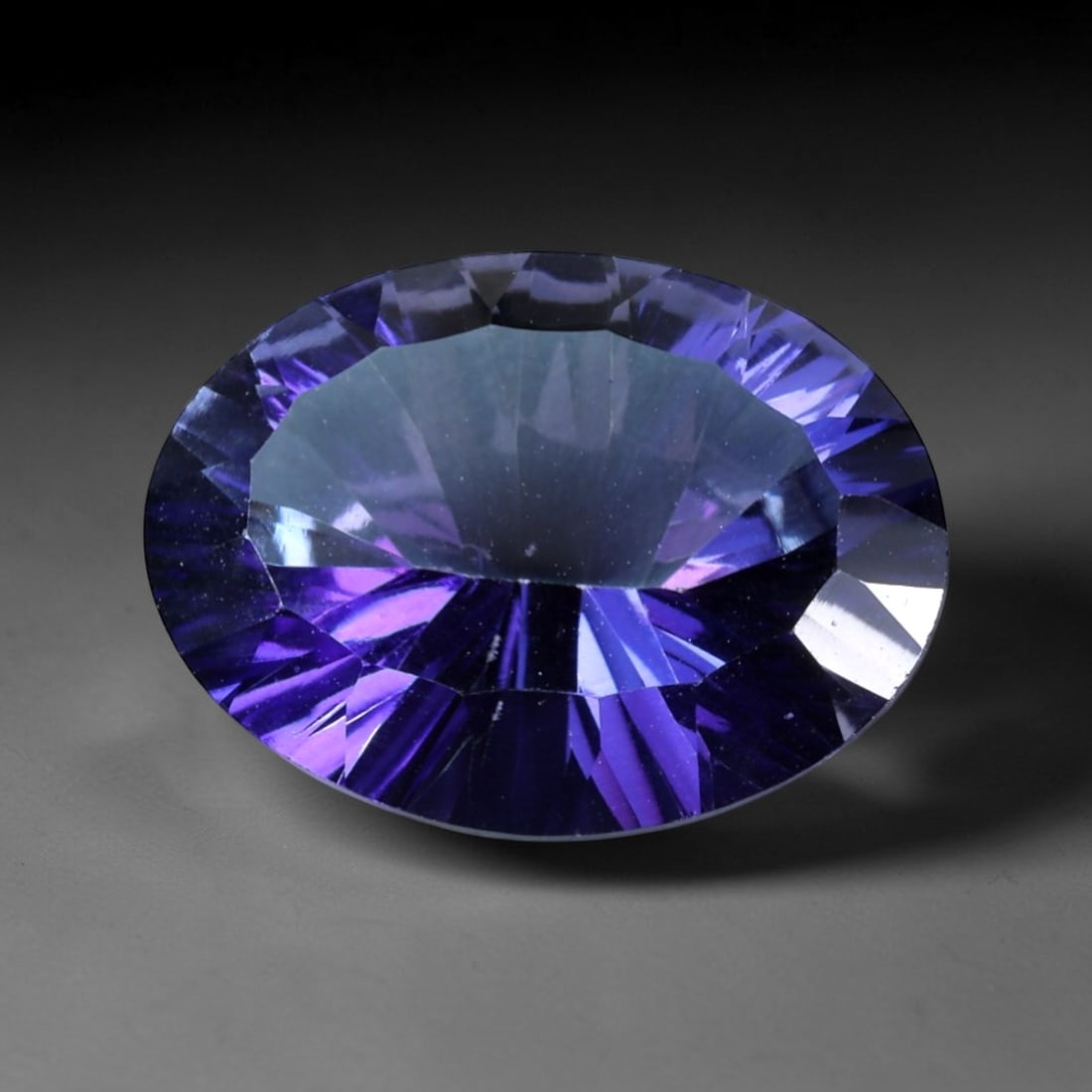 11.15ct Natural Purple Violet Topaz Oval Loose Faceted Gemstone, LZ539: This natural oval faceted topaz weighs 11.15 carats with exact dimensions 16.8x12.9x7.5mm. It displays a gorgeous gradient purple-violet hue, with deep royal purple on the outer facets transitioning g