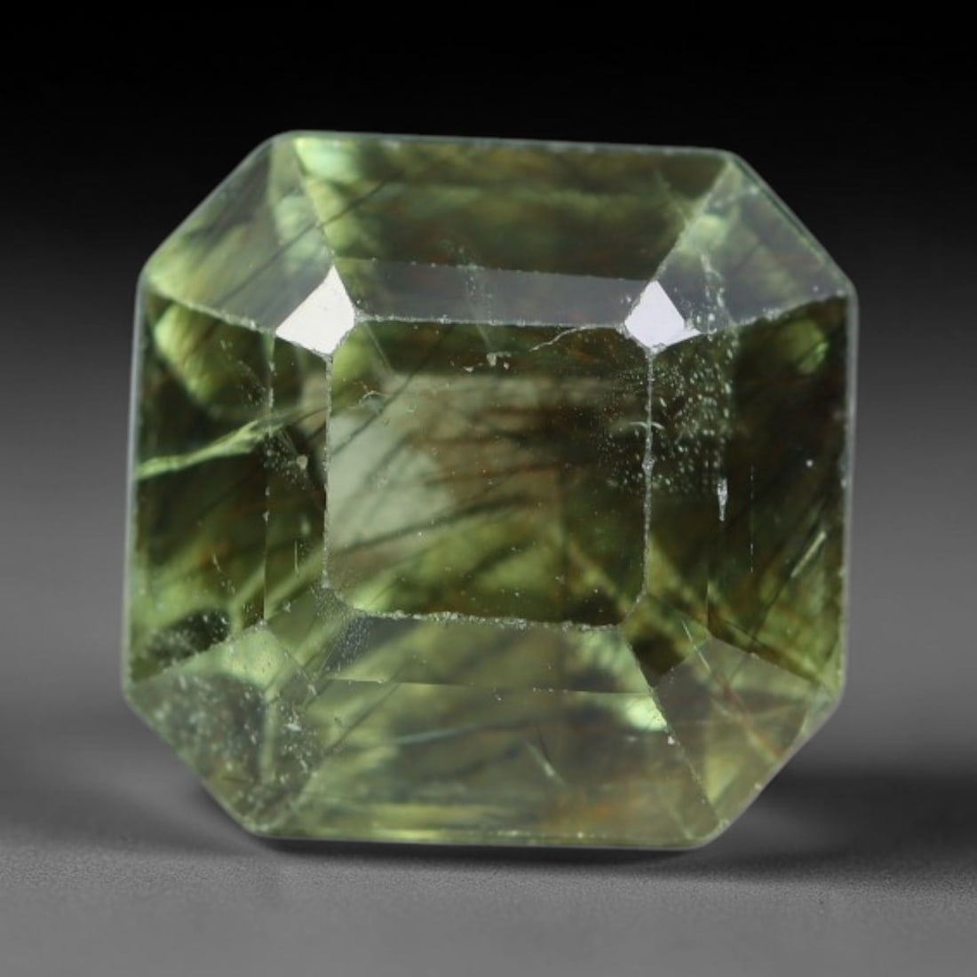 3.29 Carats Natural Green Rutilated Peridot Faceted Loose Gemstone, 70XY: This peridot is sourced from natural mineral deposits and crafted with meticulous faceting and glossy surface polishing through professional lapidary processing. Fine needle-shaped rutile filaments di