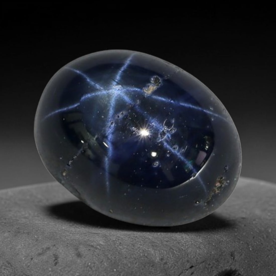 3.75 Carats Natural 6 Ray Blue Star Sapphire Loose Gemstone, 53XX: This star sapphire is crafted from natural corundum deposits and refined into a sleek polished cabochon form through professional lapidary finishing procedures. The distinct six-ray star asterism disp