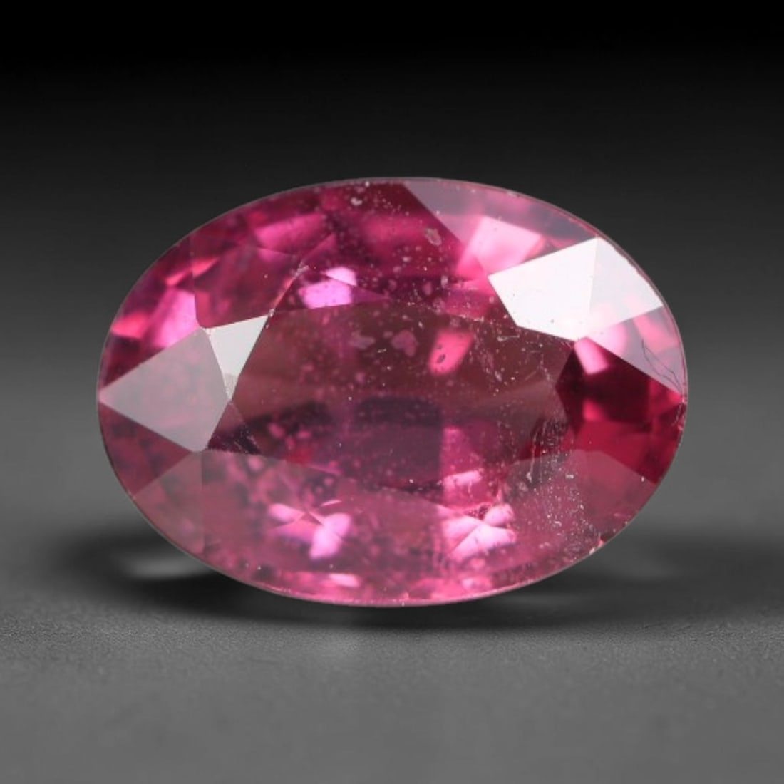 1.06 Carats Natural Rich Magenta Red Garnet Oval Faceted Loose Gemstone, 42WW: This garnet originates from natural geological mineral deposits and undergoes precise faceting and high-gloss reflective polishing via professional lapidary craftsmanship. Minute pinpoint mineral spec