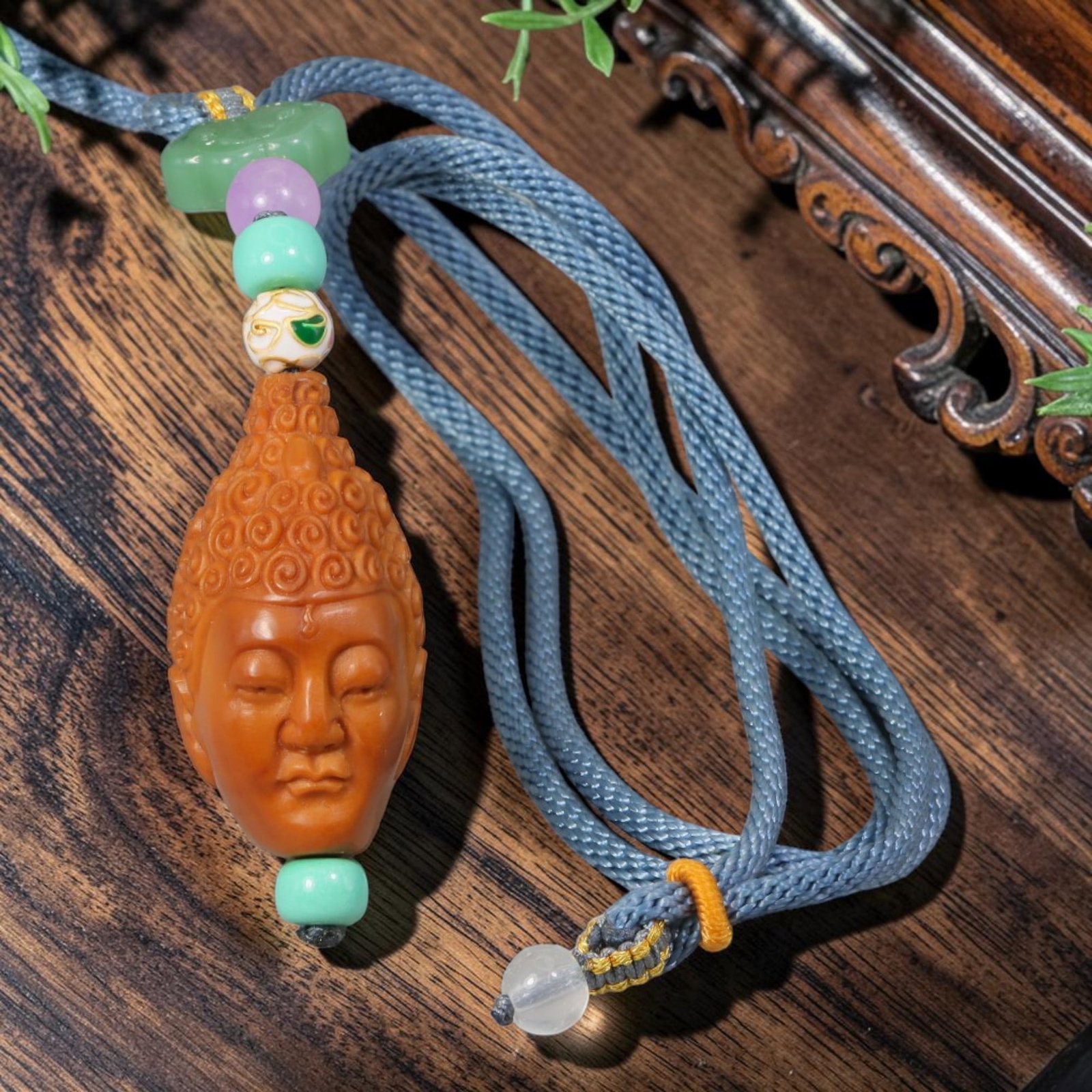 Chinese Natural Olive Nut Pendant - Serene Buddha Head Hand Carving, 23YJ: Expertly carved from solid natural olive nut kernel, this wearable pendant showcases an exquisitely detailed serene Buddha head with tightly coiled ushnisha curls and soft closed peaceful eyes, a sacr