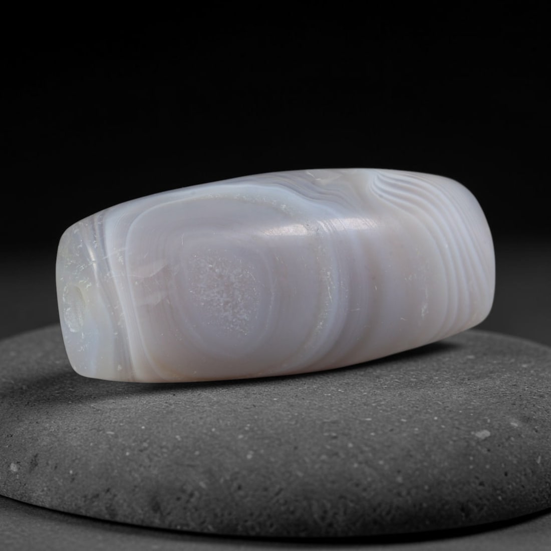 Ancient Medieval Seljuk Persian Culture Banded Agate Barrel Bead (1037-1307 CE), 88XD: This antique banded agate barrel bead originates from Seljuk Persian Culture, medieval Iranian artisans renowned for mass crafting smooth polished agate rosary and decorative spacer beads for elite Is