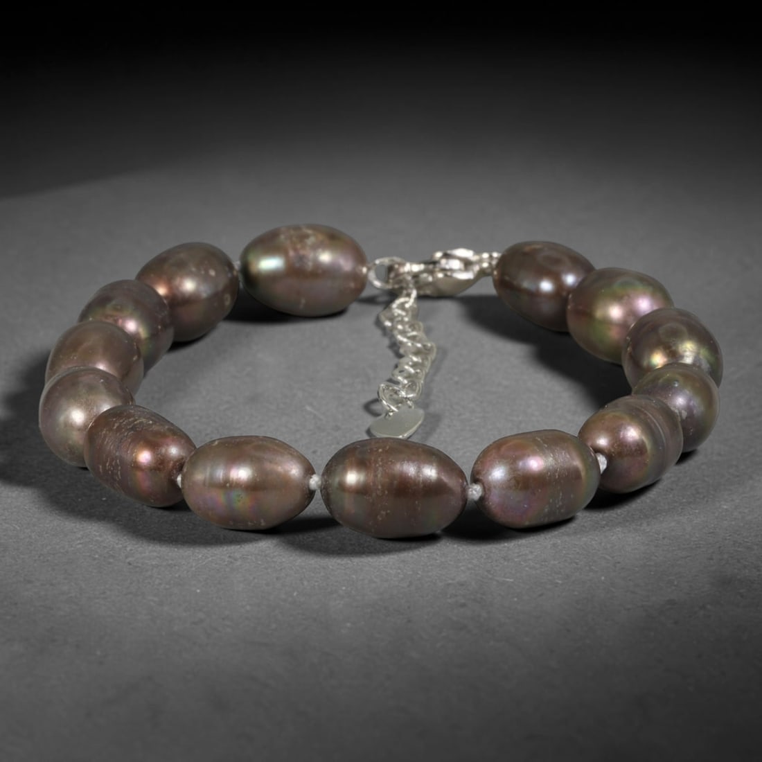 Natural Freshwater Pearl Bracelet - Baroque Peacock Dark Pearl Strand, 93YM: Hand-strung medium baroque natural freshwater pearls featuring deep peacock dark iridescence, with shifting purple, bronze and teal multi-tonal overtones across smooth oval organic bead shapes. No spa