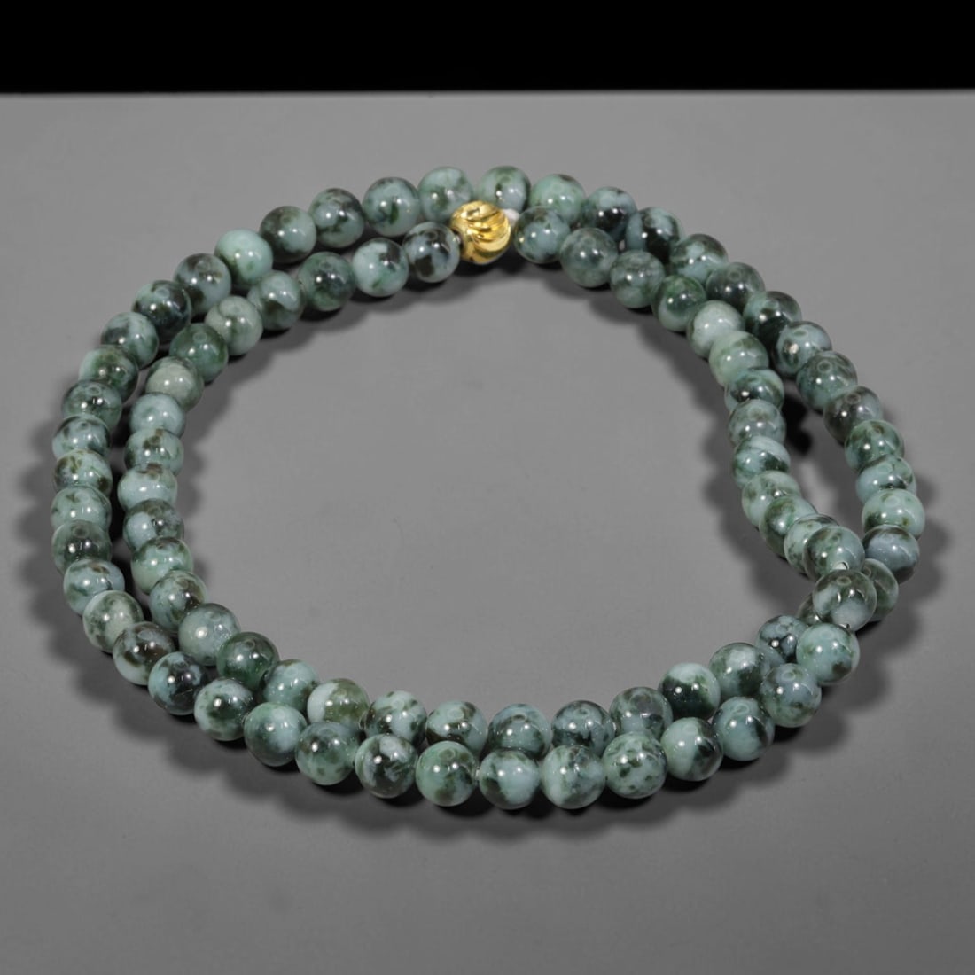 Natural Burmese Type A Floating Flower Jadeite Jade Beaded Necklace, 25WY: Formed from untreated Burmese Type A jadeite material, each spherical bead carries naturally formed floating mineral inclusions scattered evenly throughout the stone structure, finished with refined u