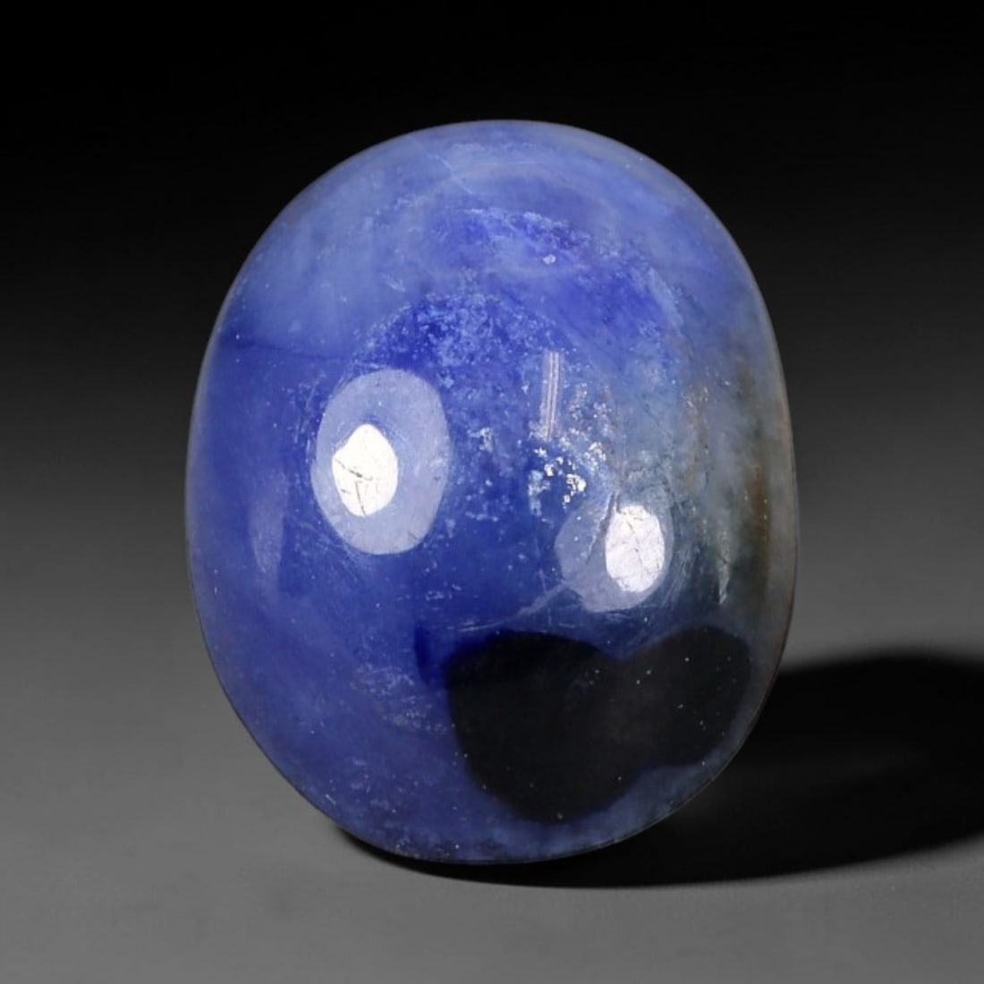 3.25 Carats Natural Mottled Royal Blue Sapphire Oval Cabochon Loose Gemstone, 91WS: This smooth domed oval cabochon sapphire features beautiful natural mottled royal blue coloration, with soft milky light blue base mixed with rich saturated blue clouding and a distinct dark mineral i