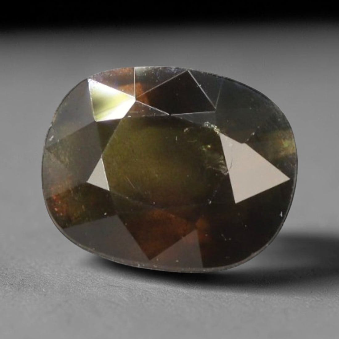 Certified 3.52 Carats Brownish Green Natural Ceylon Sapphire Single Cushion Cut Gemstone, LZ852: This single cushion cut natural sapphire carries rich earthy brownish green color saturation with soft light diffusion across its 10.16 mm x 8.07 mm x 4.81 mm dimensions, its softly rounded cushion fa