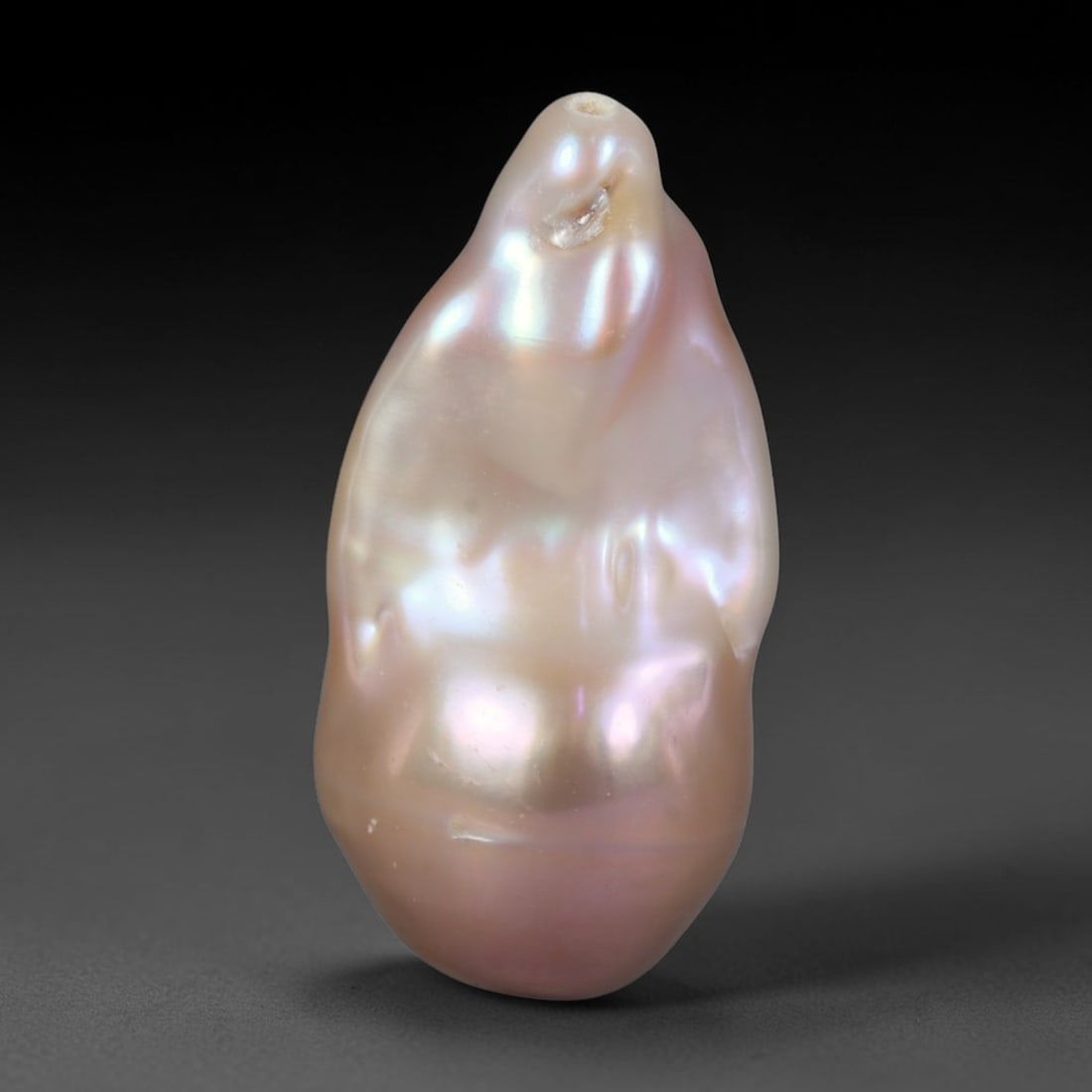 Natural Freshwater Keshi Pearl Baroque Loose Pearl, 100WE: This natural freshwater keshi pearl presents an organic irregular baroque silhouette with rich shifting iridescent nacre displaying soft champagne, peach and lavender overtones across its surface. Sub