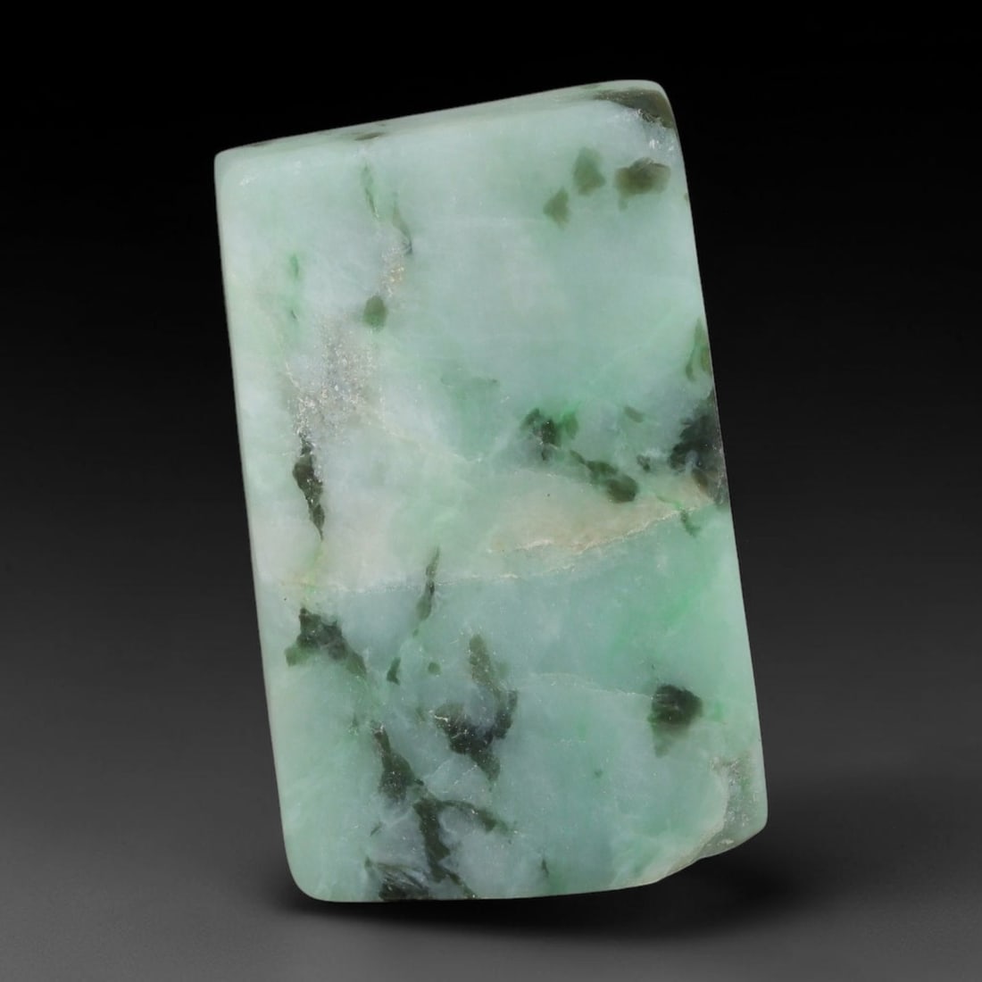 208ct Natural Type A Burmese Jadeite Jade Sliced Rough, 16YR: This specimen is a sliced rough block of natural Type A Burmese jadeite jade. The interior displays natural colour zoning with visible mineral veining and crystalline patterns typical of unprocessed j