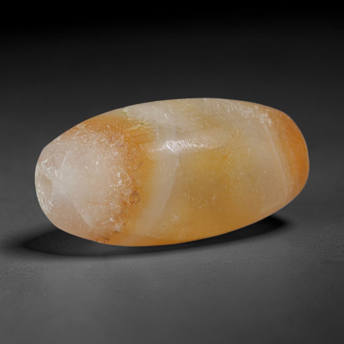 Ancient Elamite Civilization Banded Agate Barrel Bead (3200-539 BCE), 5XV: This antique banded agate barrel bead originates from the Elamite Civilization, an independent ancient Iranian craft culture that produced distinctive warm-hued agate beads for cross-continental trade