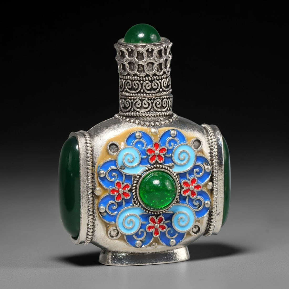 A Chinese Enamel Inlaid Gemstone Metal Snuff Bottle, 62WT: Constructed from silver-toned base metal, the squared body is ornamented with cloisonne enamel composed of cyan scroll patterns paired with small red floral accents set against a pale yellow ground. L