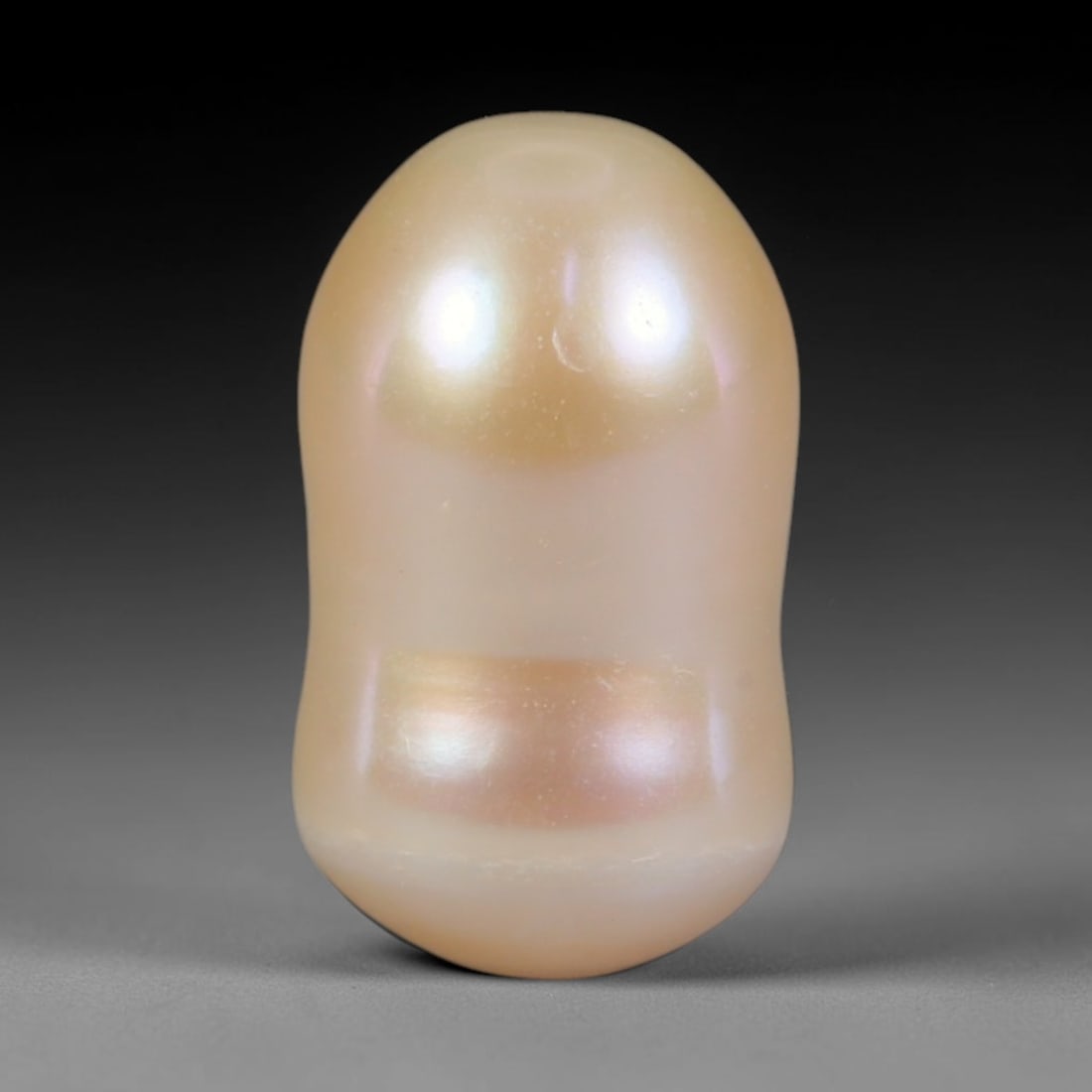 Natural Freshwater Baroque Pearl - Soft Cream Peach Organic Form, 65WE: This natural freshwater baroque pearl showcases a smooth organic asymmetrical silhouette wrapped in glossy iridescent nacre, with warm cream and subtle peach iridescent overtones flowing evenly across