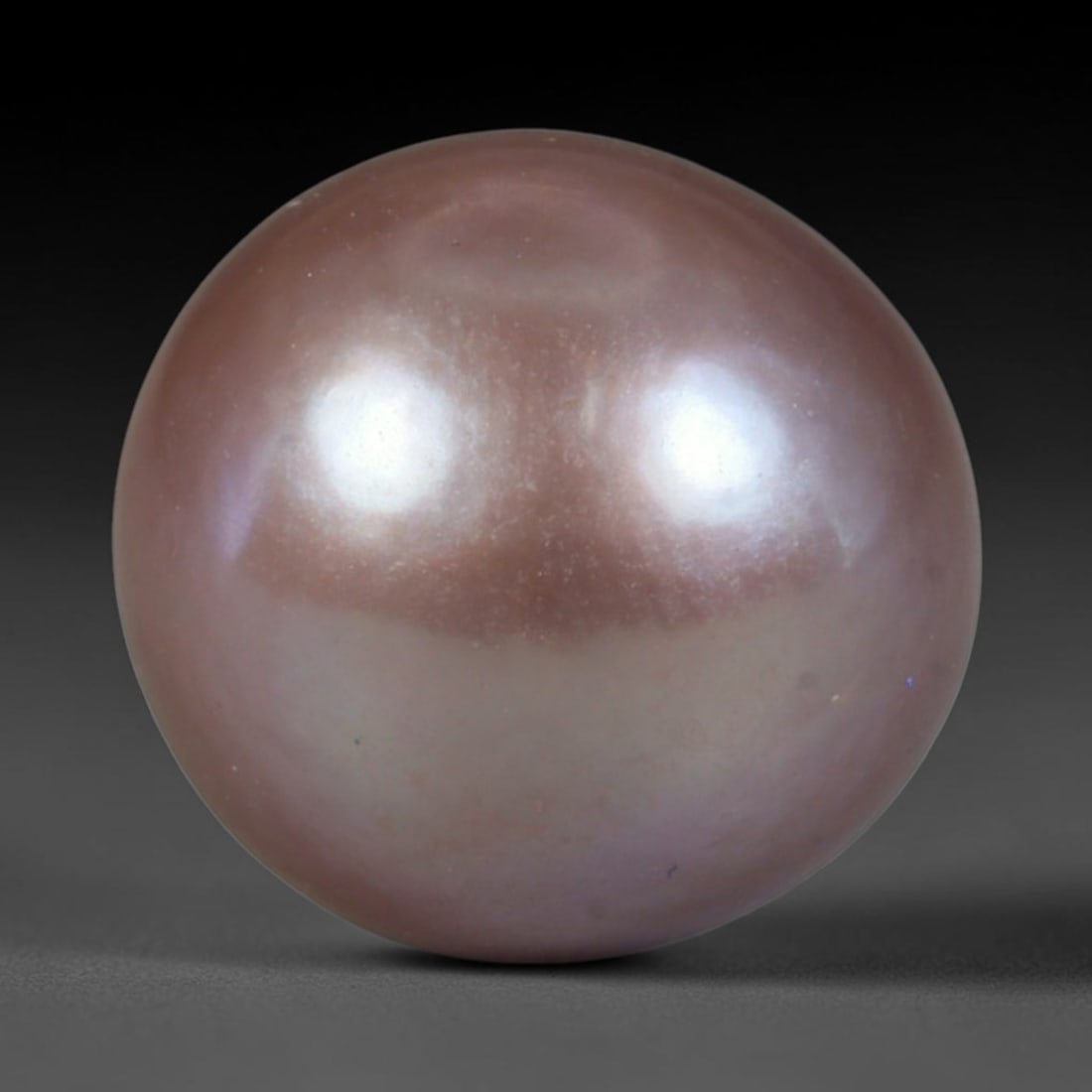 Natural Freshwater Pearl - Dusty Mauve Lavender Sphere 12mm, 60WE: This natural freshwater pearl boasts a smooth, symmetrical spherical shape enveloped in luminous iridescent nacre featuring deep dusty mauve blended with soft lavender overtones across its polished su