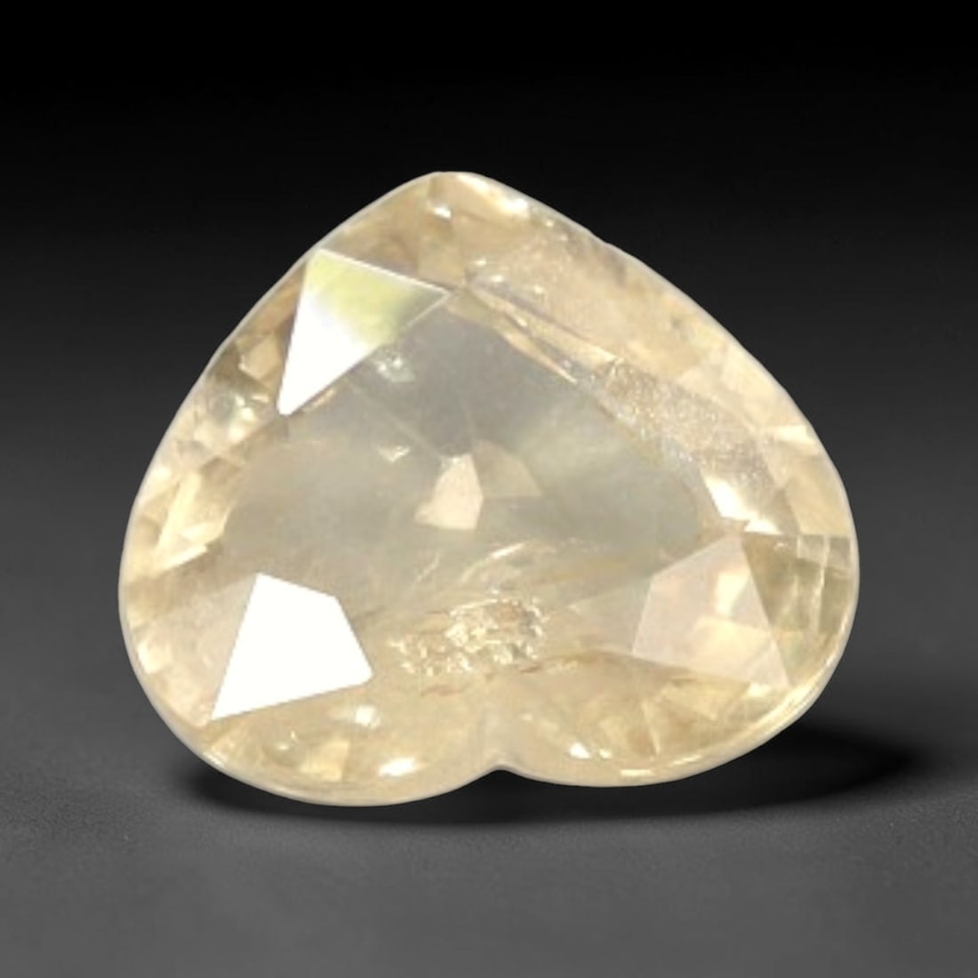 Certified 1.59 Carats Pinkish Orange Natural Ceylon Sapphire Single Heart Faceted Gemstone, LZ854: This single heart faceted natural sapphire holds soft, even pinkish orange saturation that glows gently under all lighting, with finely balanced faceting across its 6.98 mm x 7.79 mm x 3.30 mm dimensi