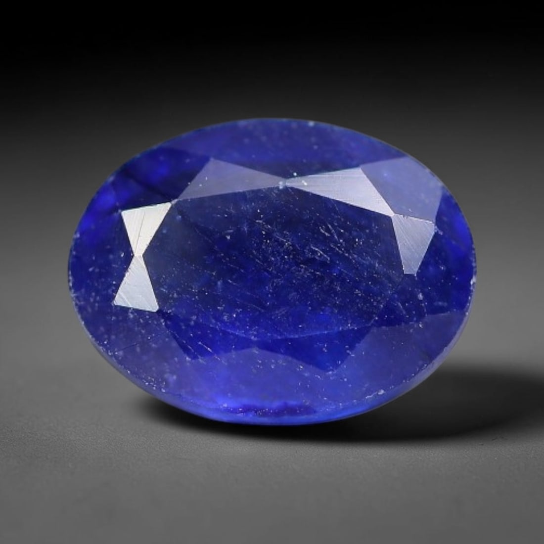 1.81 Carats Royal Blue Sapphire Oval Faceted Loose Gemstone, 12WJ: This classic oval faceted sapphire displays rich saturated royal blue color glowing through crisp polished multi-facet cuts, featuring natural fine internal fissures and tiny scattered mineral micro s