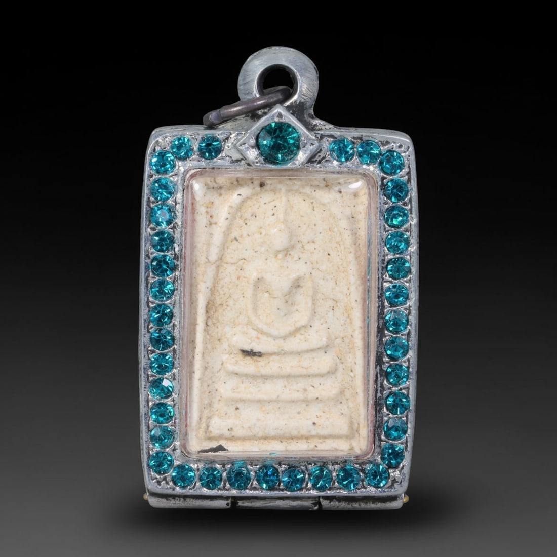 Thai Gilded Clay Metal Amulet Buddhist Votive Pendant, 19ZB: Formed from fired clay with applied gilded surface layers, the piece uses traditional molding techniques characteristic of Southeast Asian devotional craft. The construction adheres to standard region