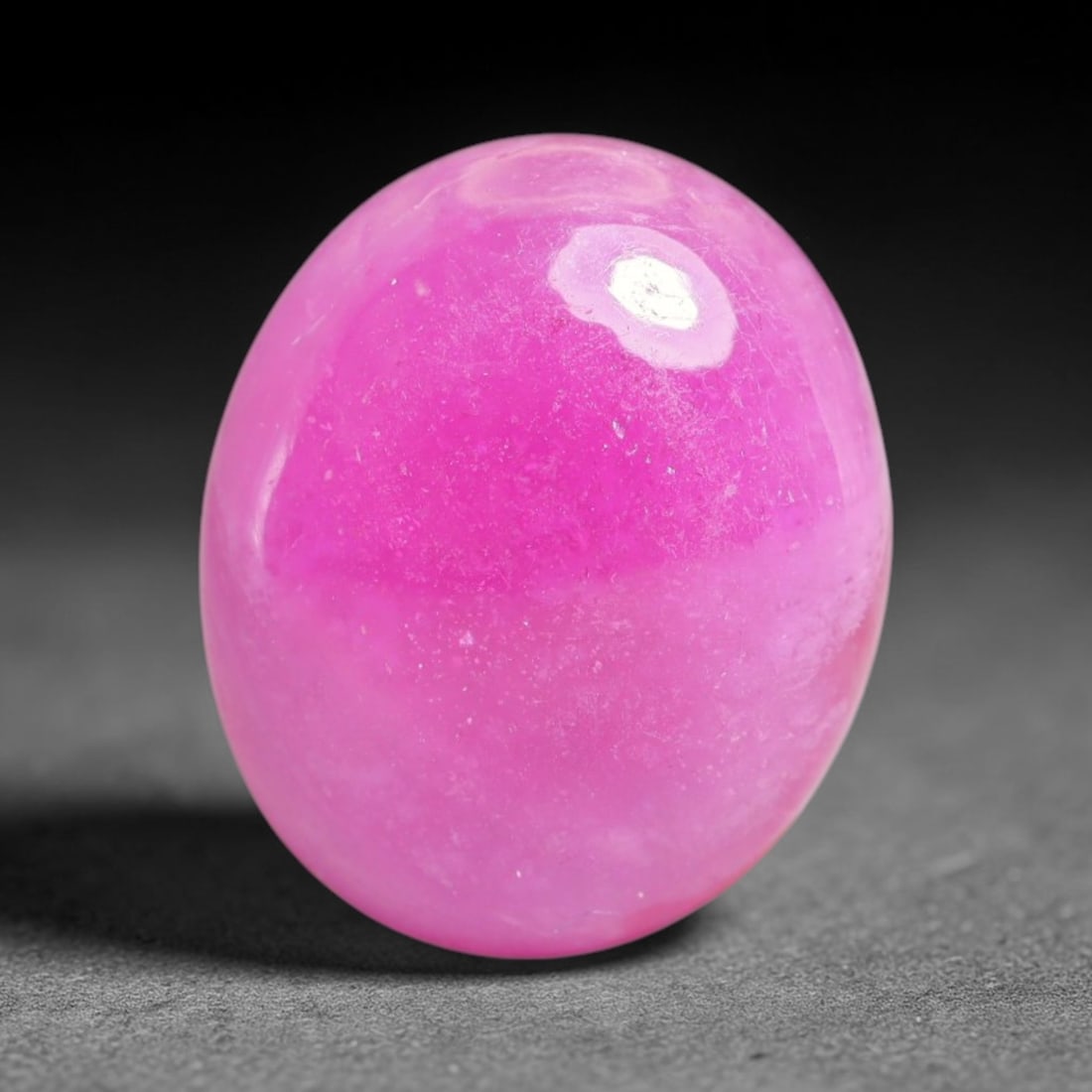 11.49 Carats Natural Mozambique Ruby Cabochon Loose Gemstone, 19XX: This ruby originates from Mozambique natural mineral deposits and receives professional cabochon grinding and polishing treatment to form a smooth glossy exterior surface. Tiny mineral particles and n