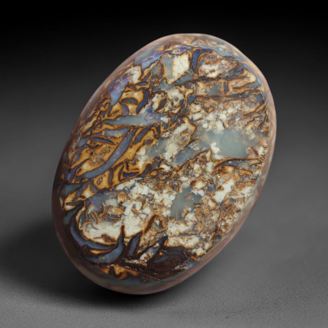 9.98 Carats Boulder Opal Cabochon - Intricate Matrix Pattern Specimen, 64XM: This 9.98ct boulder opal cabochon, measuring 17x12mm, is a striking example of Australia's iconic gemstone, showcasing the unique beauty of nature's artistry. The oval cabochon is polished to a smooth