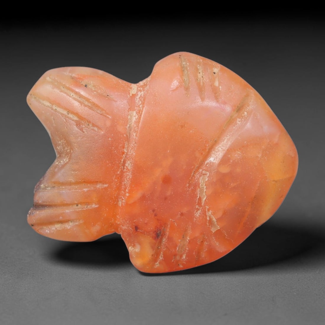 Ancient Coptic Egyptian Hand Polished Carnelian Amulet, 86XZ: Small antique wearable sacred talisman shaped from solid natural carnelian agate mineral, originating from Coptic Egyptian Nile Valley cultural and devotional traditions. Carnelian was an exceptionall