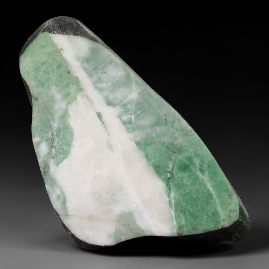 167ct Natural Type A Burmese Jadeite Jade Sliced Rough, 84YN: This specimen is a sliced rough block of natural Type A Burmese jadeite jade. The interior displays natural colour zoning with visible mineral veining and crystalline patterns typical of unprocessed j