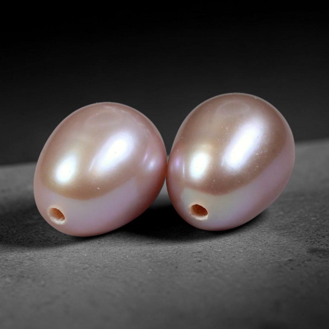6.26ct Natural Soft Mauve Pink Orient Freshwater Egg Shape Pearl Pair, 69XZ: Matching pair of natural freshwater egg/oval pearls, uniform dimensions 9x7mm with neat fully drilled through holes ready for immediate jewelry assembly. Each pearl boasts a smooth satiny nacre surfac