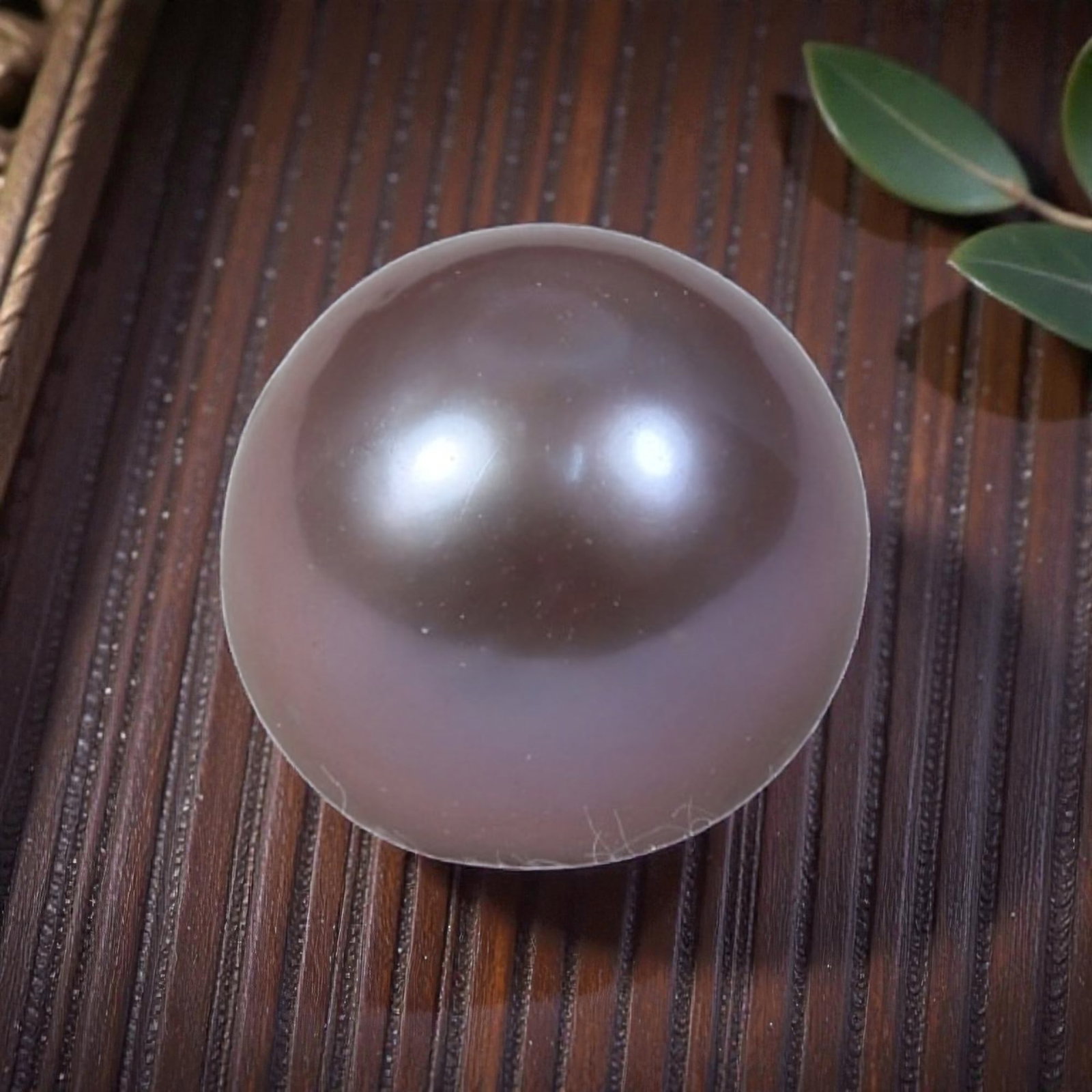 6.99ct Natural Freshwater Pearl - Muted Lavender Taupe Sphere 9.9mm, 46YG: This specimen is natural freshwater pearl, fully polished into a compact symmetrical spherical cabochon with muted lavender taupe nacre luster and deep smoky reflective crown tones. Fine delicate surf