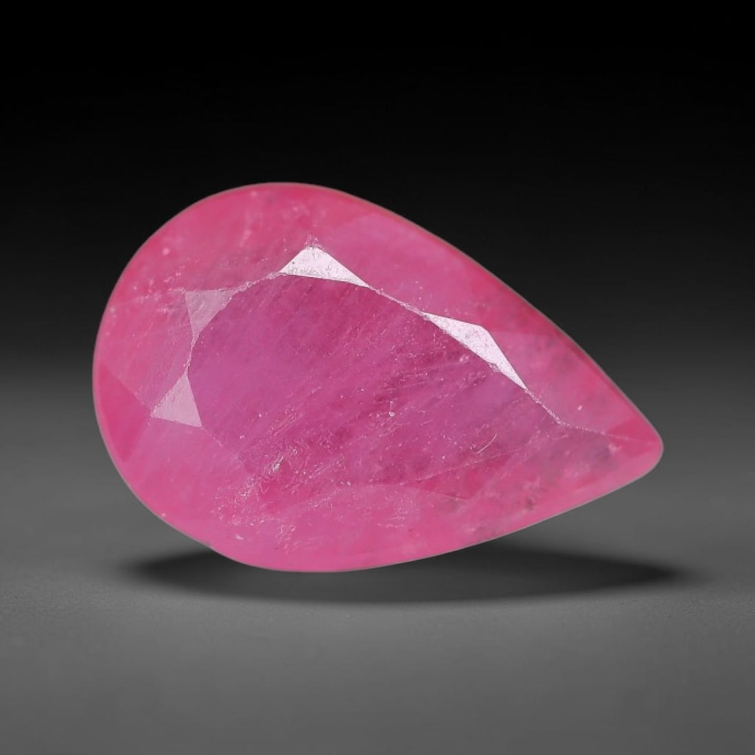 0.96 Carats Natural Orange Sapphire Pear Faceted Loose Gemstone, 98XM: This natural orange sapphire is fashioned in a classic pear brilliant faceted cut, presenting soft warm orange hues consistent with natural corundum specimens. Fine scattered mineral specks and faint 