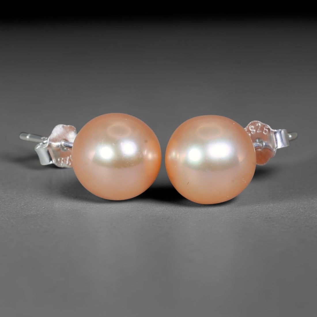 Perfect Round Soft Peach Natural Freshwater Pearl Stud Earrings, 5WS: Timeless matching stud earrings featuring perfectly spherical smooth natural freshwater pearls with uniform 8.6mm round dimensions. Each pearl displays flawless thick nacre with a warm soft peach blus
