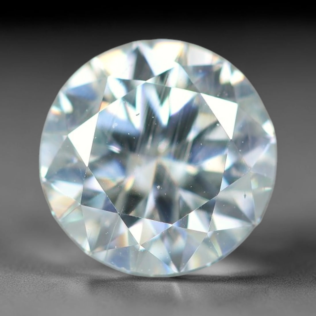 0.96 Carats Aqua Toned Moissanite Loose Gemstone, 62WP: This moissanite features dimensional measurements of 6.4x3.9mm, lab-grown silicon carbide material valued for superior light refraction that delivers vivid multi-hued sparkle across all lighting condi