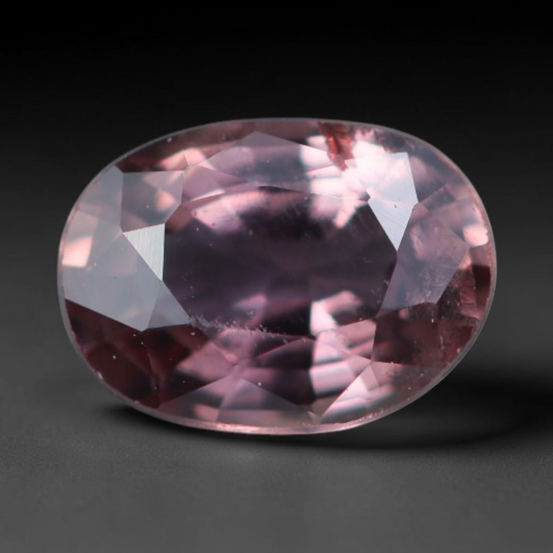 0.61 Carats Natural Blush Pink Sapphire Oval Faceted Loose Gemstone, 71XV: Natural soft blush pink corundum sapphire expertly cut into an oval faceted loose gemstone, finished with mixed brilliant facets to highlight gentle pink tonal depth. The crystal features delicate ros